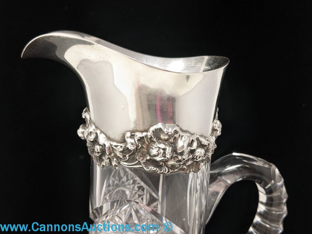 Antique brilliant cut glass pitcher with Gorham sterling silver repousse collar, part of the Gallery Consignments Online Estate Auction Richmond VA.