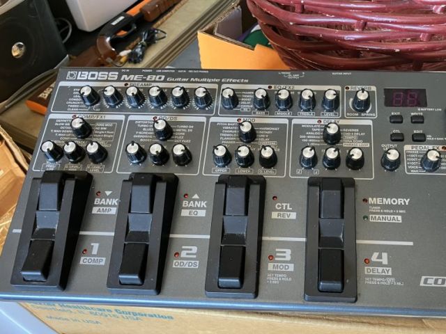 Boss ME-80 guitar multiple effects pedal board with four footswitches and numerous control knobs