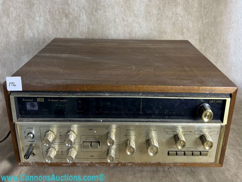 1970s quadraphonic stereo receiver, full front panel with tuner window and multiple control knobs