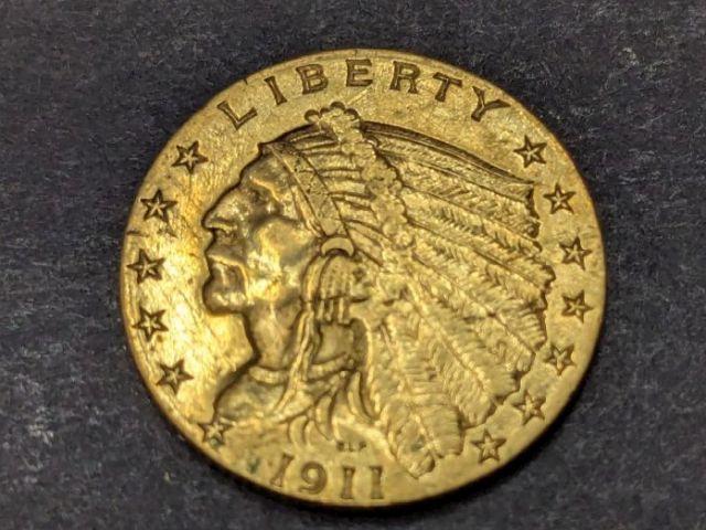 1911 Indian Head $2.50 gold coin (quarter eagle) showing incuse Liberty portrait with “LIBERTY,” stars around the rim, and the date 1911.