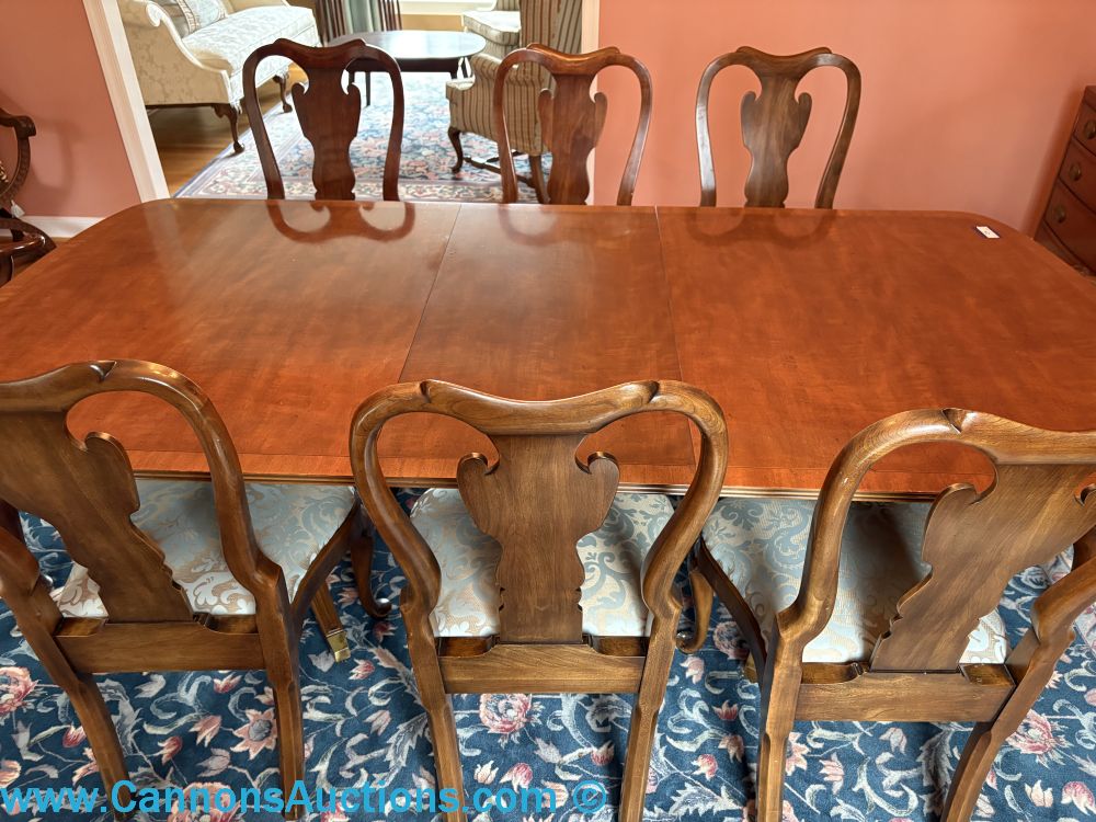 Queen Anne style double pedestal extending dining table with eight matching chairs, 45” x 91” x 28.5”.