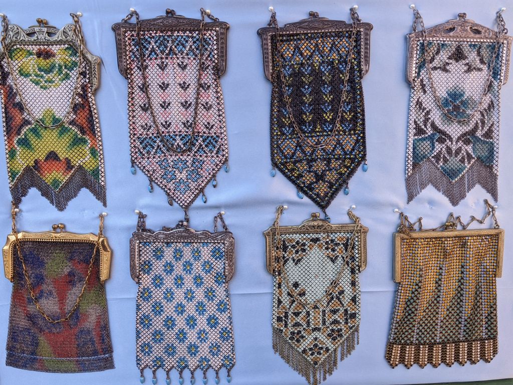 Vintage Purses and Handbags—group of eight antique beaded mesh purses with metal frames and chain handles, assorted patterns.
