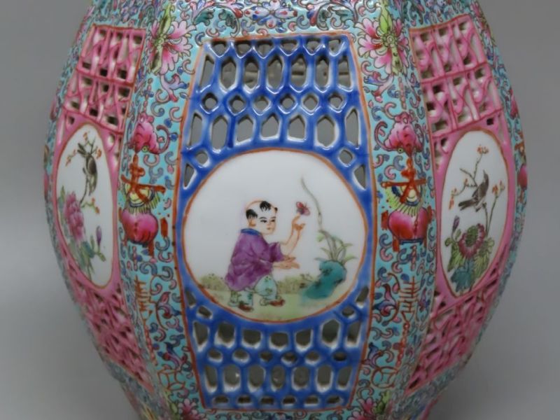 19thC Chinese porcelain pot-pourri holder on matching base, 9" tall, with pierced panels and famille rose medallion scenes.