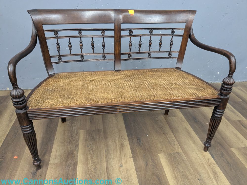 Antique Regency style mahogany bench with woven seat and decorative spindle backrest, measuring 33 x 44 x 20 inches