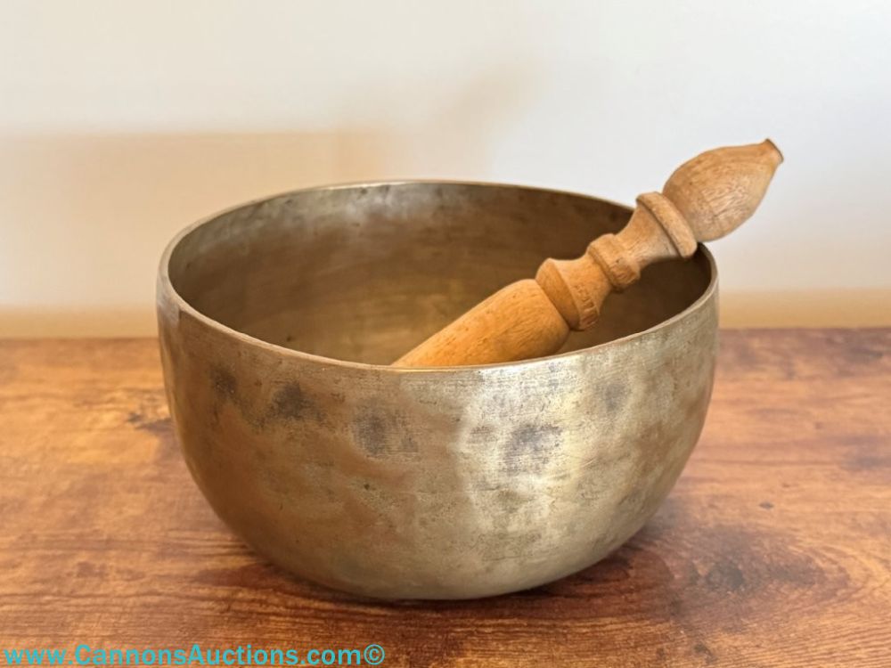 Antique Tibetan hand-hammered brass singing bowl with wooden striker, 7-inch diameter