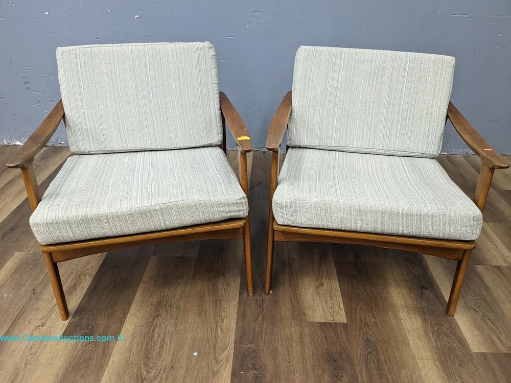 Pair of Mid-Century Modern arm lounge chairs in the Gallery Consignments Online Estate Auction Richmond VA, with wood frames and upholstered cushions.