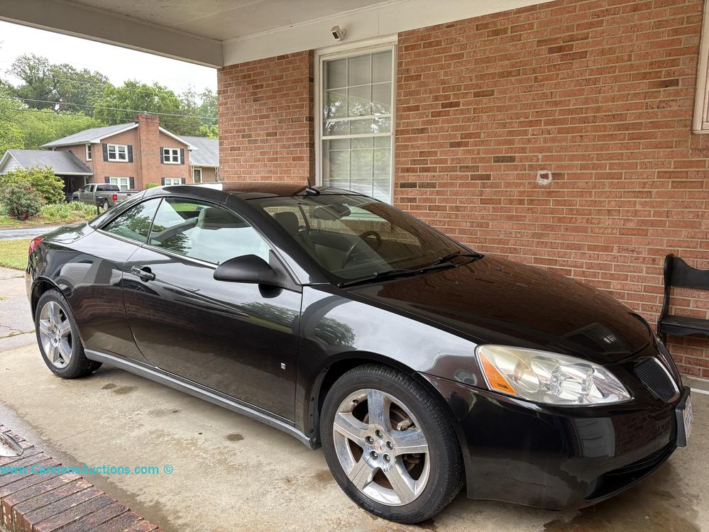 2009 GM Pontiac G6 GT black hardtop convertible with automatic transmission, OnStar, leather power heated seats, VIN 1G2ZH361294104503, and 55,264 miles, featured in the Colonial Heights VA Online Estate Auction.