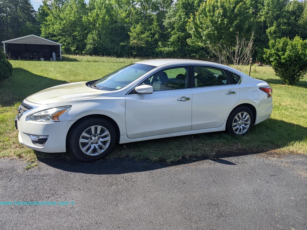 2014 Nissan Altima white four-door sedan, one owner, VIN 1N4AL3AP5EC139674, showing 100,200 actual miles, offered in the Powhatan County estate auction.