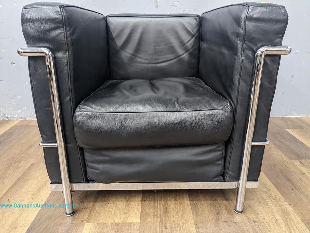Le Corbusier-style LC2 armchair with black leather cushions and a polished chrome tubular steel frame