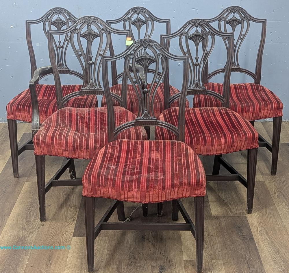 Six Potthast Bros. carved wood dining chairs with red striped upholstered seats, including one armchair