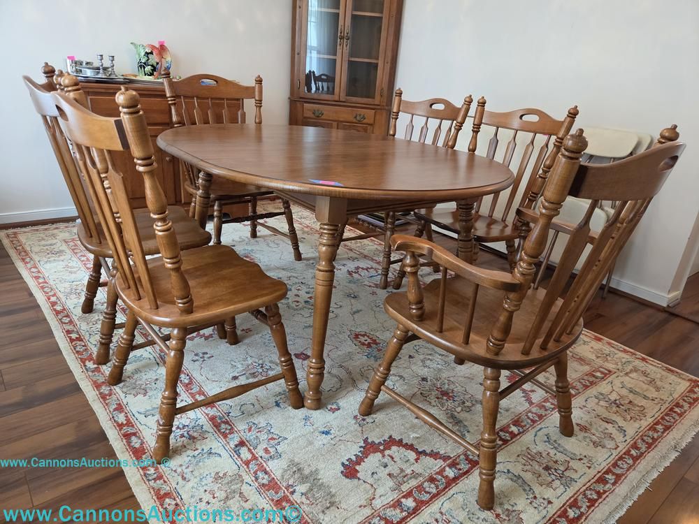 Tell City Chair Company oak dining set with oval table, two armchairs, and four spindle-back side chairs