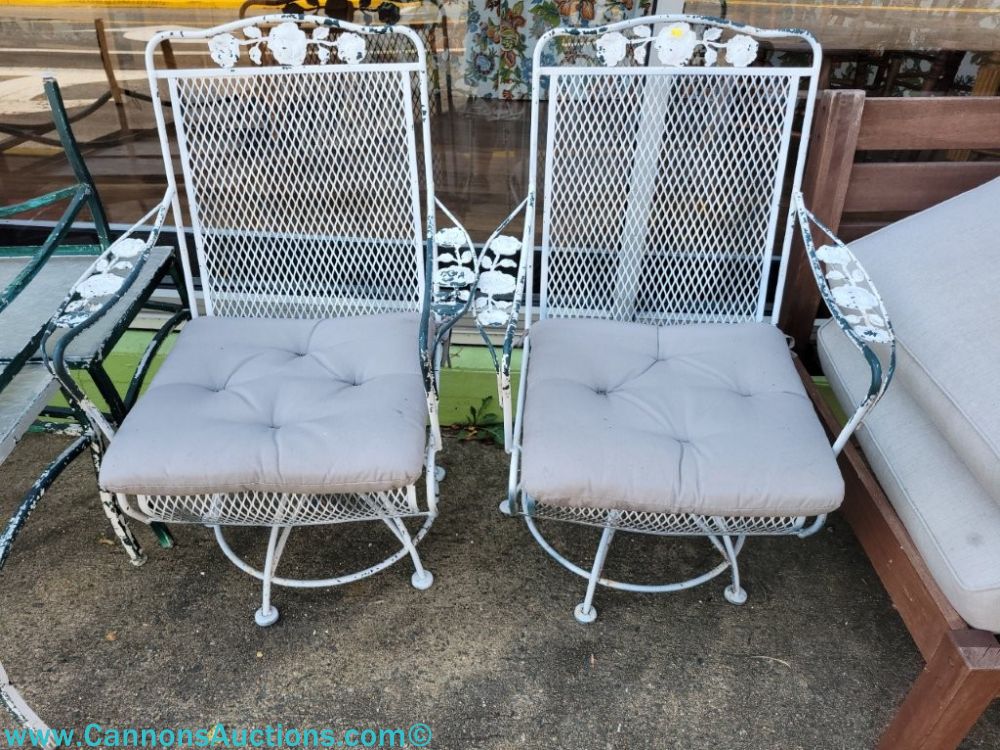 Pair of Meadowcraft rose design iron mesh swivel rockers with light cushions, offered in an Orange VA online estate auction.