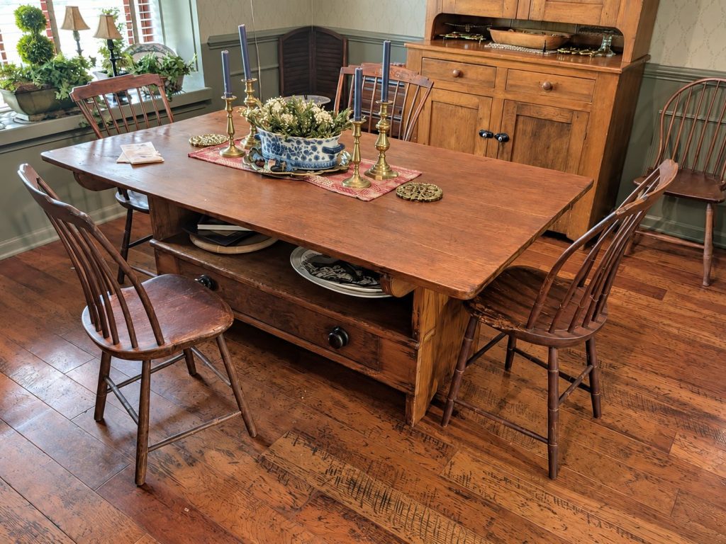 Antique country dining table with Windsor chairs and pine step-back cupboard in Earlysville VA estate auction.