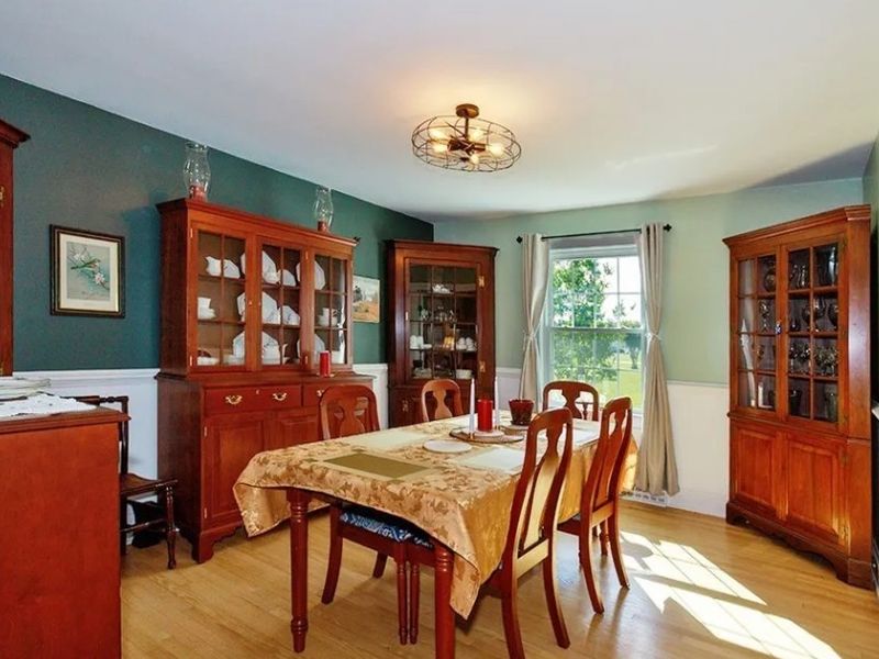 Dining room furnished with Suter’s and Henkel Harris-style traditional wood furniture from a Surry County, Virginia online estate auction.