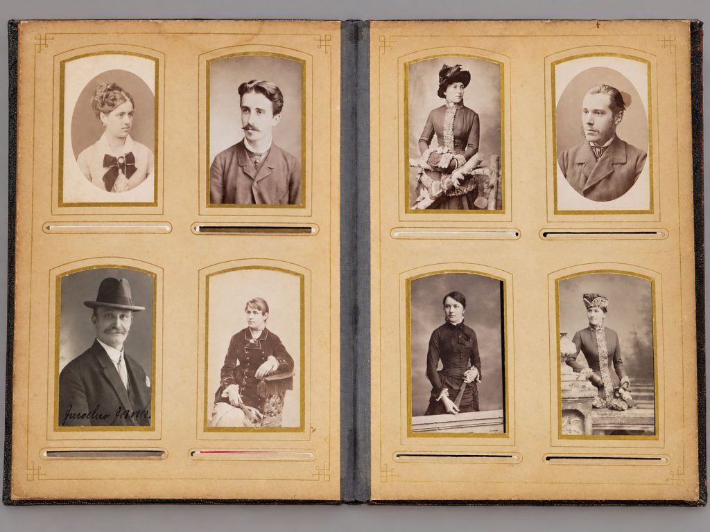 Antique Art Nouveau red velvet photograph album with ornate metal plaques and Victorian CDV portraits, featured in Cannon's Hopewell VA online estate auction.