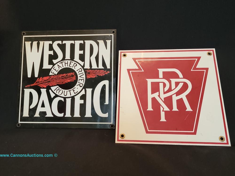 Vintage-style Ande Rooney Western Pacific Railroad Feather River Route enamel sign with red feather graphic and Pennsylvania Railroad PRR metal sign, Chester VA estate auction.